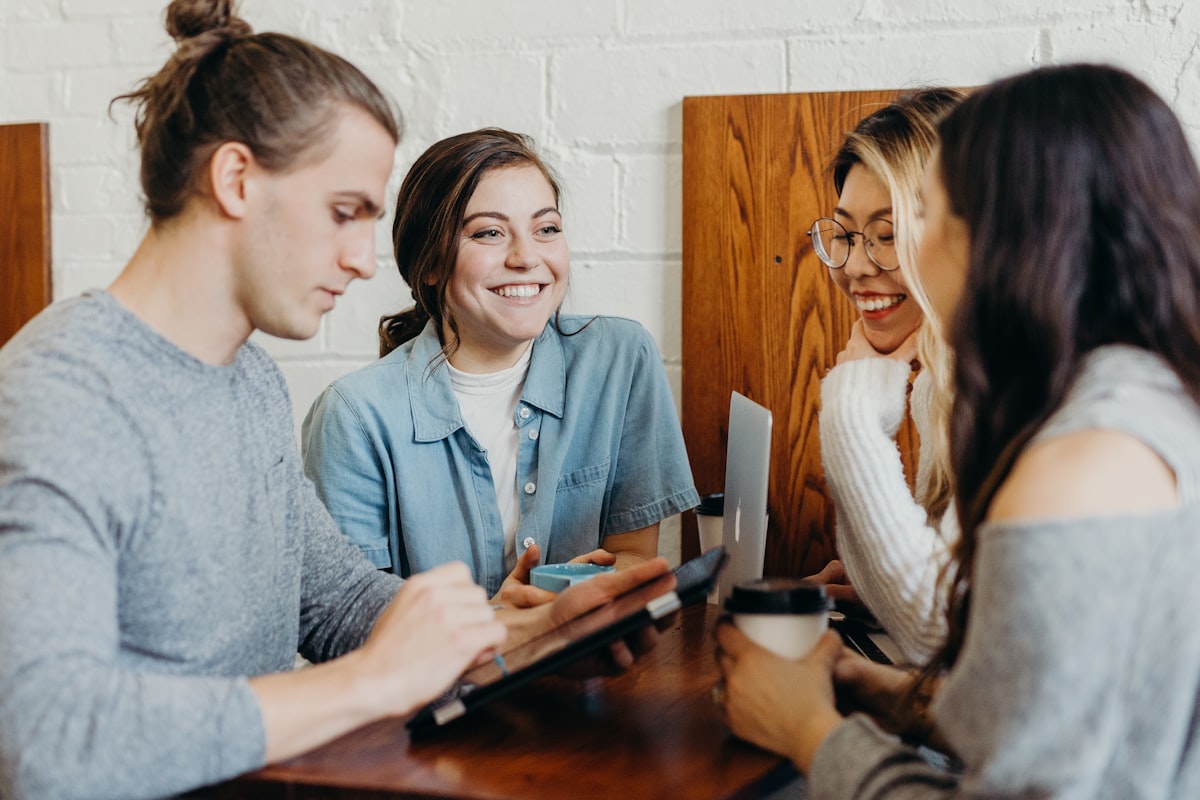 Leaders in a casual conversation over coffee